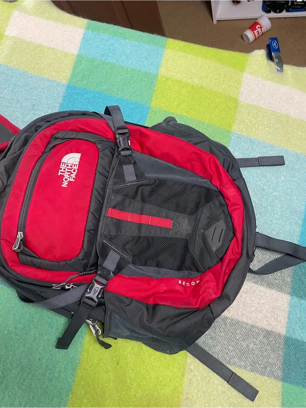 The North Face Recon backpack in charcoal gray and bright red